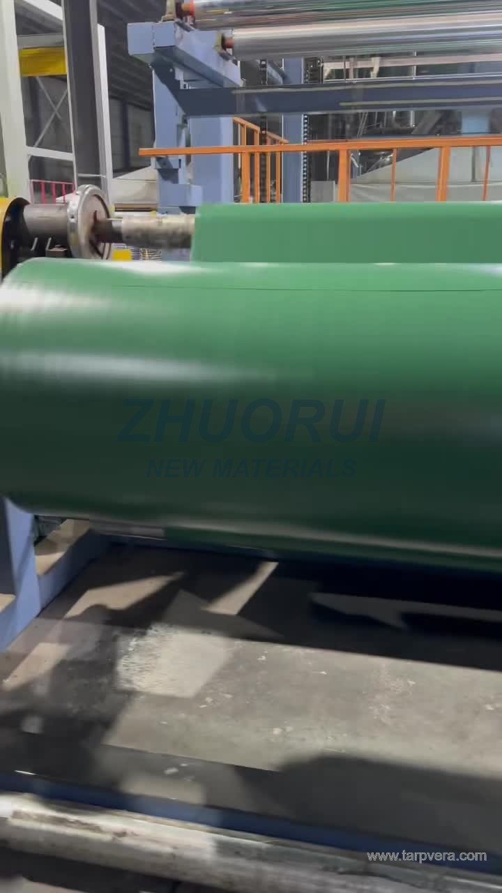 Frame from the supplied PVC production-line video showing green material passing through equipment